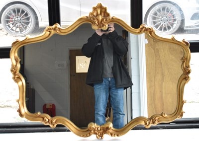 Lot 97 - A reproduction gilt framed overmantel mirror,...