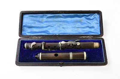 Lot 5205 - A cased rosewood piccolo.