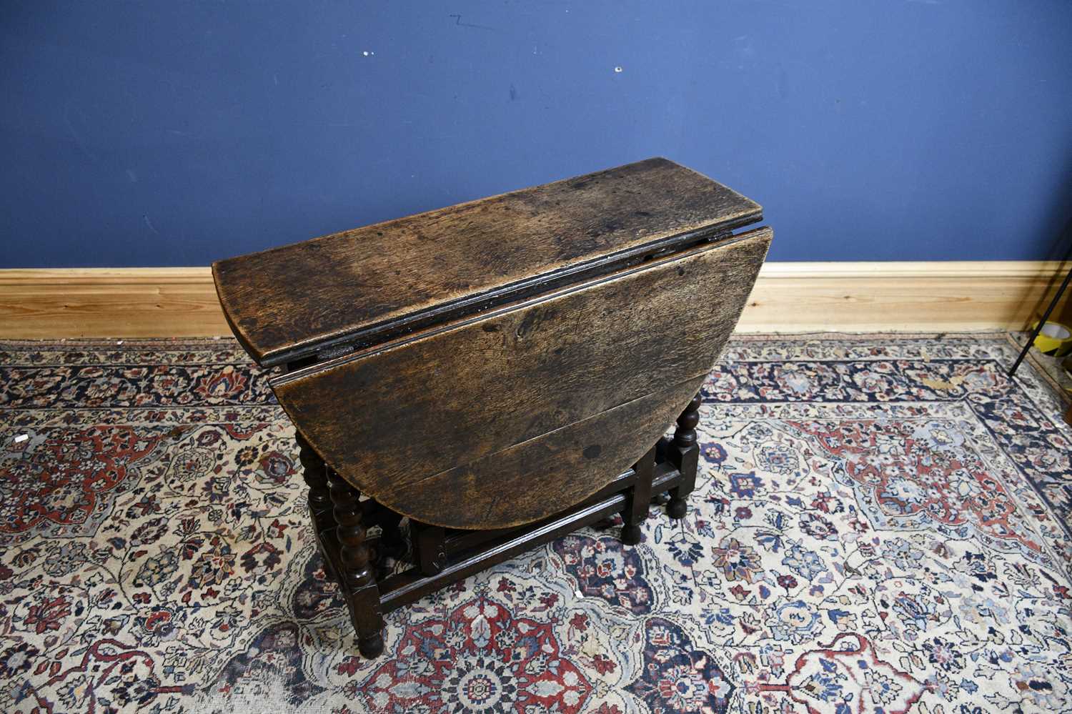 Lot 6525 - An 18th century oak oval drop-leaf table with...