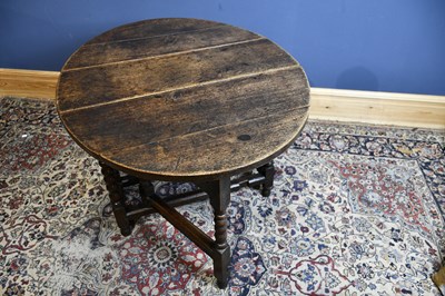 Lot 6525 - An 18th century oak oval drop-leaf table with...