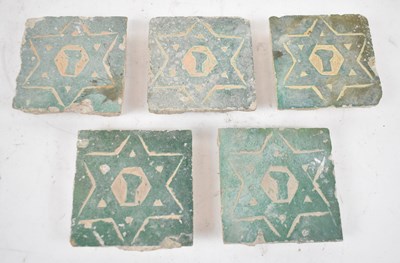 Lot 366 - A group of five ancient Moroccan tiles.