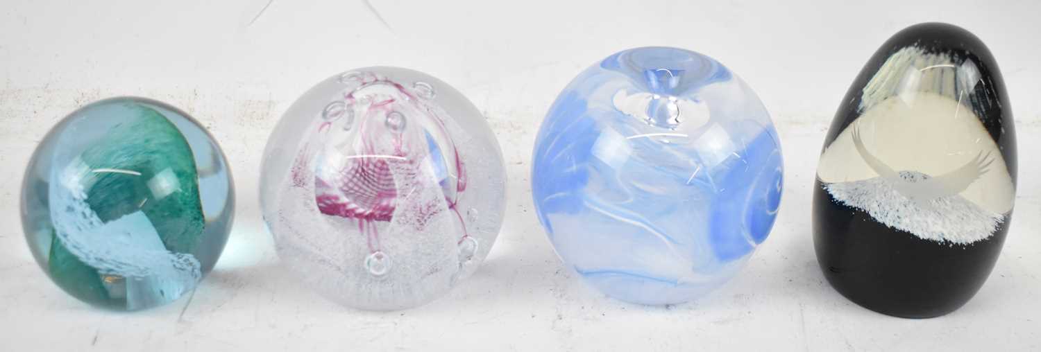 Lot 589 - A group of four Caithness paperweights, to...