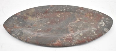 Lot 319 - An oval tray made up of ammonite fossils, 37.5...