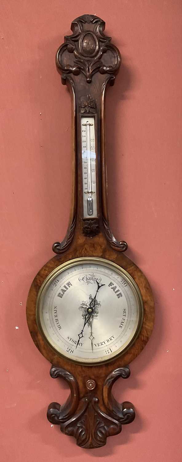 Victor Barometer Lot 6375 - A Victorian walnut barometer with silvered