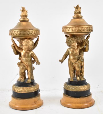 Lot 369 - A pair of decorative gilt cherub ornaments on...