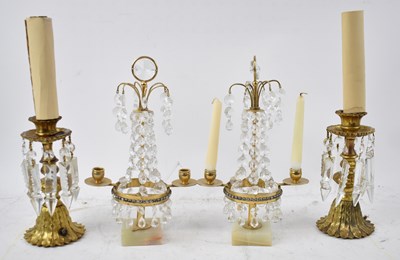 Lot 142 - A pair of gilt metal lamps suspending cut...