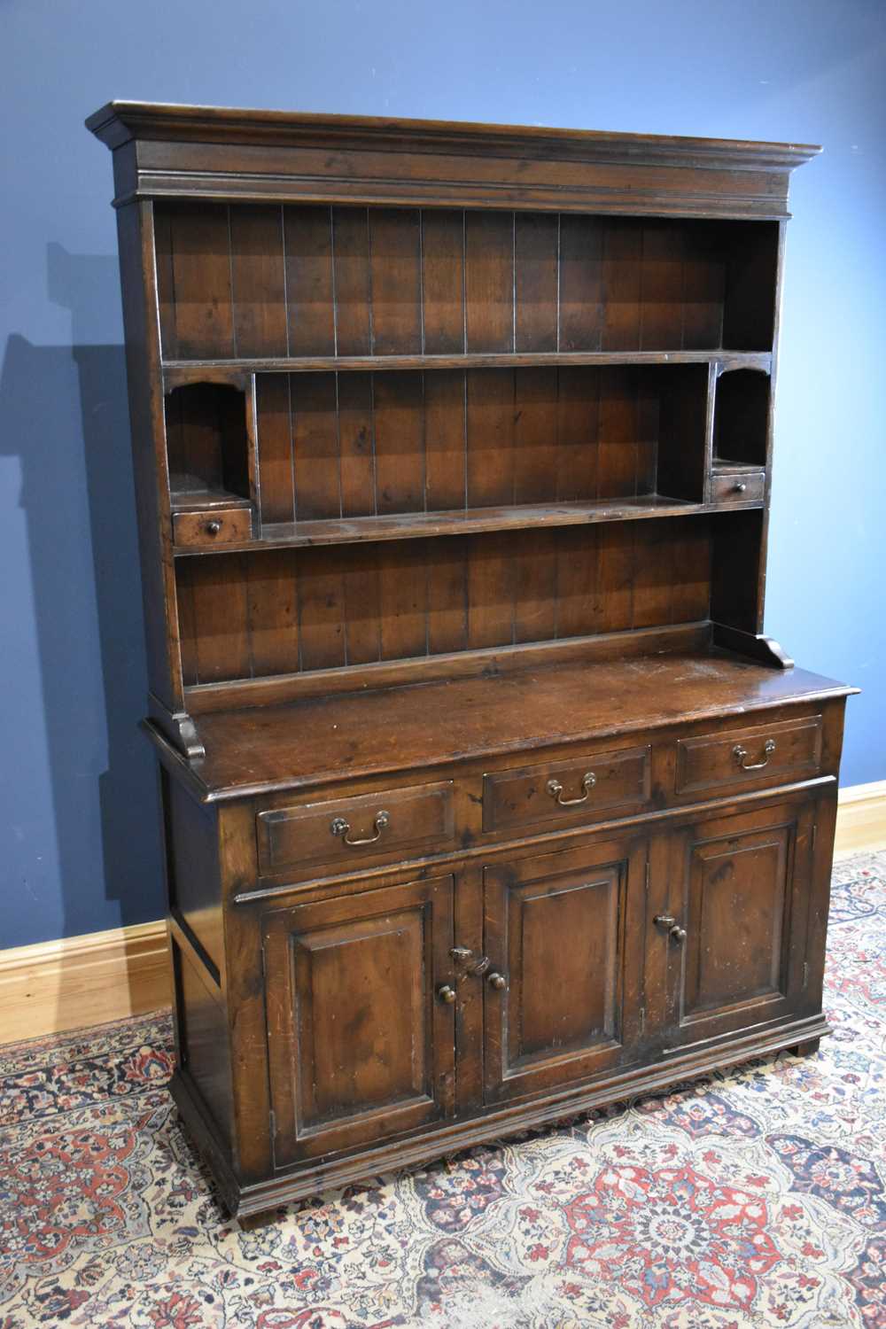 Lot 6722 - A reproduction dark oak dresser with