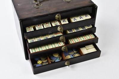Lot 5035 - A mahjong set with bone and bamboo counters,...