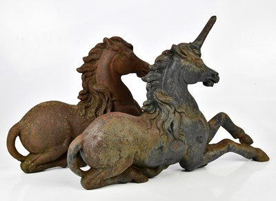 Lot 395 - A pair of cast iron unicorn door stops, one...