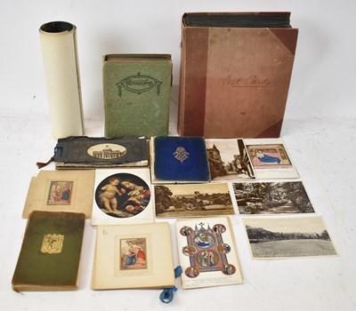 Lot 433 - An early 20th century postcard album...