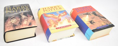 Lot 429 - A group of three Harry Potter books, one first...