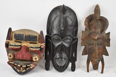 Lot 427 - A carved tribal mask with polychrome...