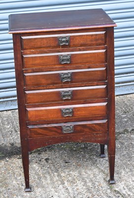 Lot 68 - An Edwardian stained beech six drawer music...