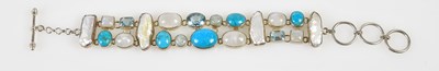 Lot 558 - An unusual silver bracelet set with turquoise,...