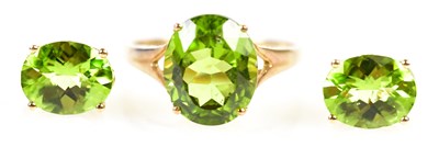 Lot 275 - A 9ct yellow gold green peridot dress ring,...