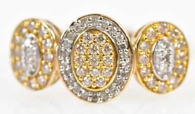 Lot 271 - A yellow metal and diamond ring formed of...