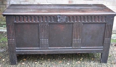 Lot 24 - An 18th century oak plank top coffer, with...