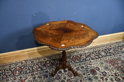 Lot 12 - A 19th century mahogany carved tripod table,...