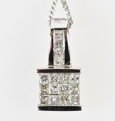 Lot 355 - An 18ct white gold and diamond set pendant...