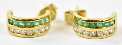 Lot 644 - A pair of 18ct yellow gold emerald and diamond...