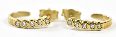 Lot 652 - A pair of 9ct yellow gold and five stone...