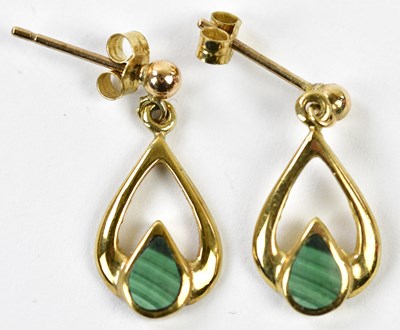 Lot 653 - A pair of 9ct yellow gold earrings set with...