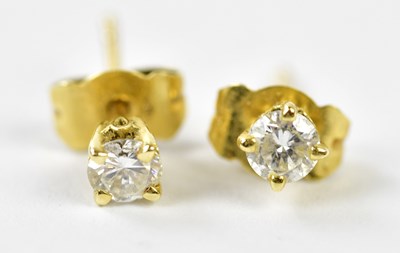 Lot 663 - A pair of 18ct yellow gold and diamond four...