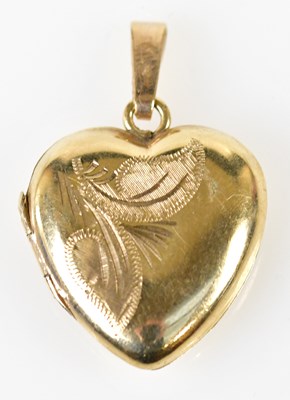 Lot 462 - A 9ct yellow gold heart shaped pendant locket...