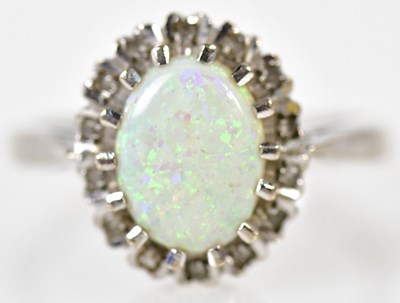 Lot 154 - An 18ct white gold opal and diamond oval...