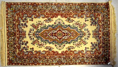 Lot 83 - An Afghan cream ground carpet