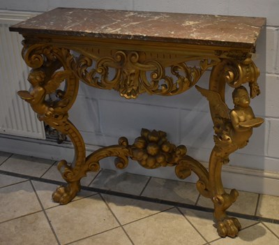 Lot 4 - A gilt wood console table with veined marble...