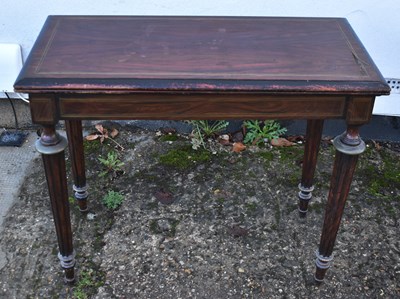 Lot 22 - A 19th century simulated rosewood and brass...
