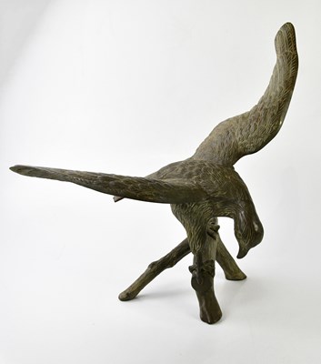 Lot 5150 - A bronze bird of prey sitting on a branch,...