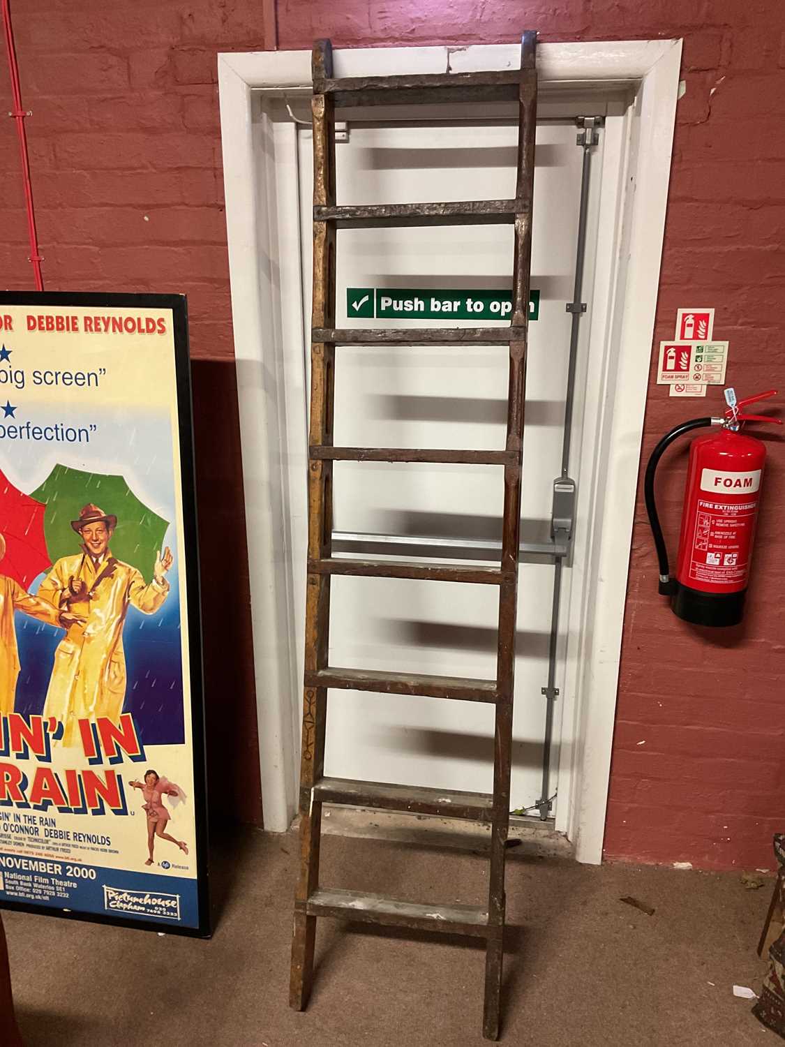 Lot 6464 - A set of decorative wooden ladders, height 217cm.