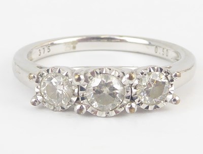 Lot 1040 - A 9ct gold three-stone diamond ring