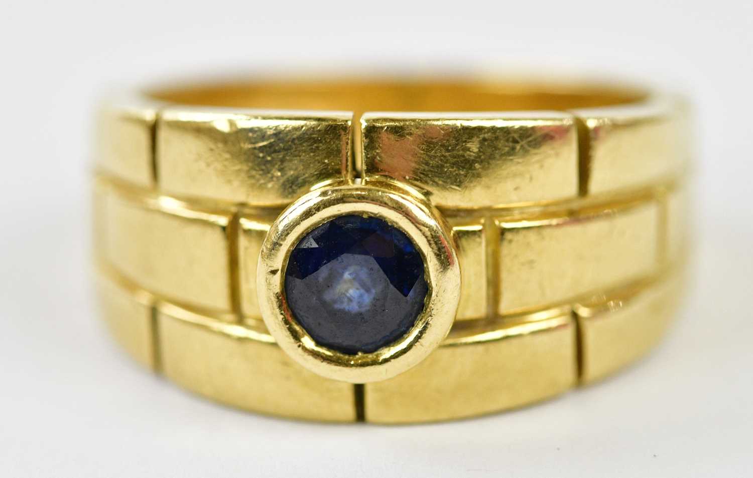 Lot 63 - CARTIER; an 18ct yellow gold and sapphire...