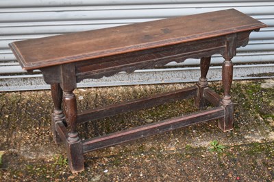 Lot 61 - A rustic oak joint stool, width 107cm.