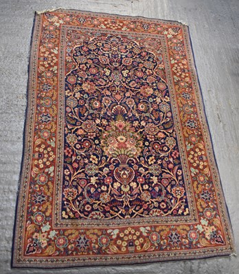 Lot 124 - A red ground floral decorated carpet, 202 x...