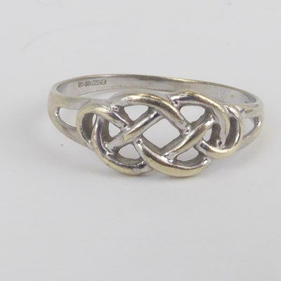 Lot 1049 - A 9ct white gold Celtic design ring