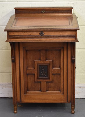 Lot 30 - A late 19th century oak Davenport desk, with...
