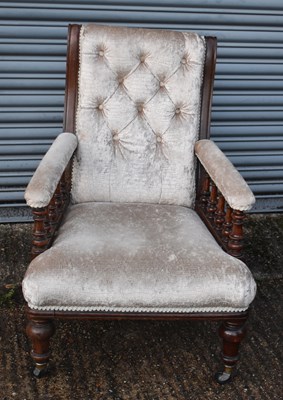 Lot 40 - A 19th century oak framed elbow chair.
