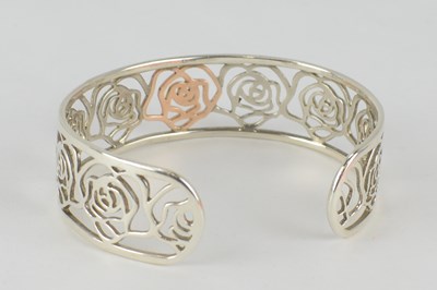 Lot 1073 - CLOGAU; a silver and rose gold 'Royal Roses'...