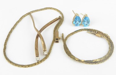 Lot 1134 - A pair of 14ct gold earrings with a blue claw...