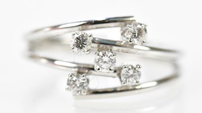 Lot 132 - A white metal five stone diamond set ring with...