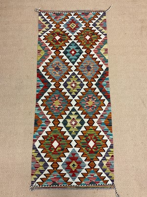 Lot 552 - A Chobi Kilim runner, length 153cm, width 61cm.