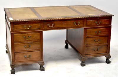 Lot 25 - A mahogany nine-drawer twin pedestal desk