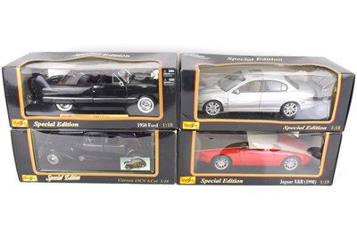 Lot 396 - MAISTO; four boxed collectors' 1:18 scale...