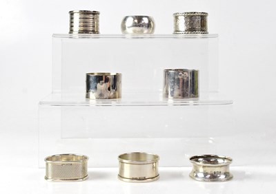 Lot 895 - Eight hallmarked silver napkin rings, various...