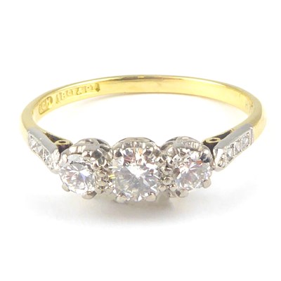 Lot 1046 - An 18ct gold three-stone diamond ring, with...