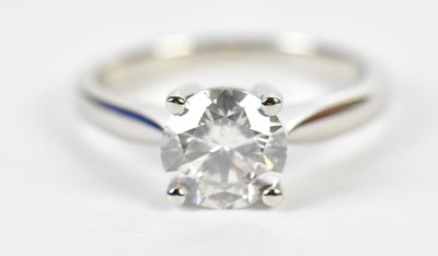 Lot 35 - A platinum and diamond single stone ring, the...